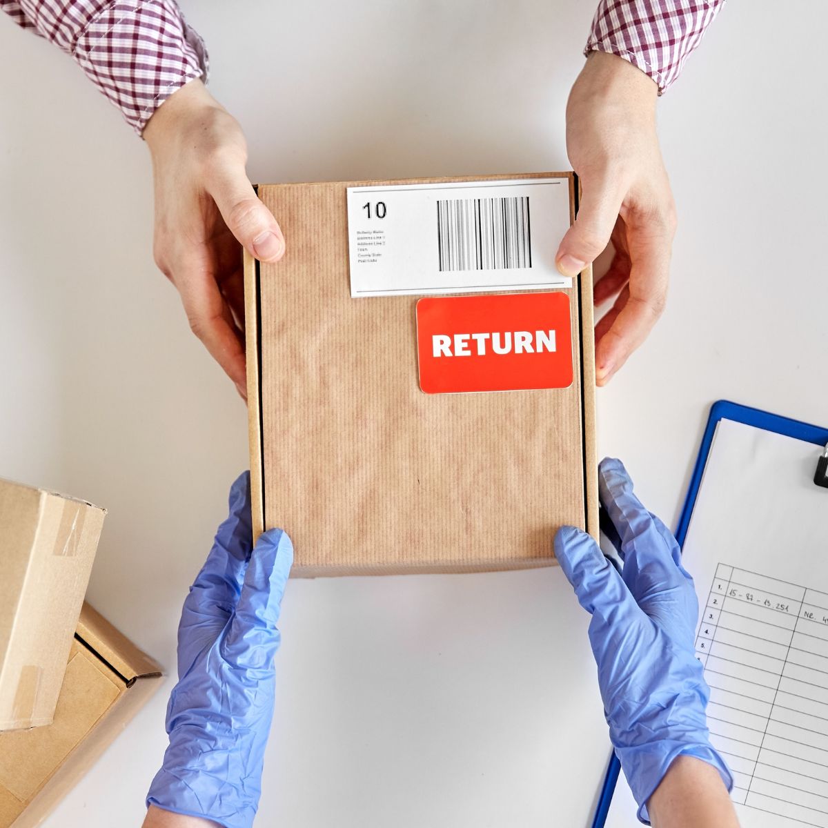 A cardboard package with a red "RETURN" label being exchanged between two pairs of hands, one gloved and the other bare, with a clipboard and checklist visible in the background.